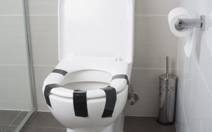 toilet with lid taped down